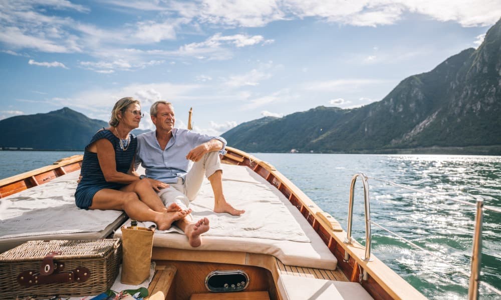 A couple enjoys life on a boat because they made a budget for retirement when they were younger.