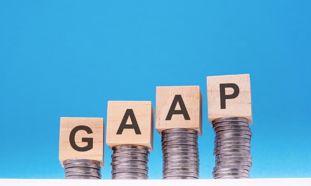 A picture depicting GAAP earnings using coins and blocks.