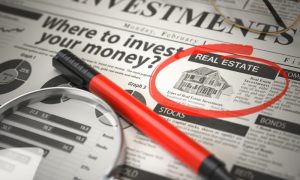 A newspaper with a home advertisement circled by someone considering self-directed IRA real estate options