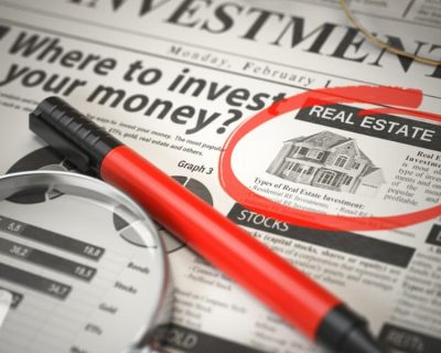 A newspaper with a home advertisement circled by someone considering self-directed IRA real estate options